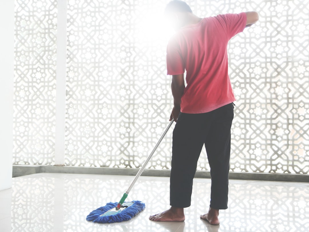 a-person-with-a-broom-and-a-bucket-polu6snb-wq